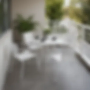 Stylish white balcony chairs arranged around a small table