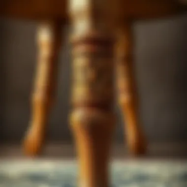 Close-up of a handcrafted wooden chair leg showcasing intricate design