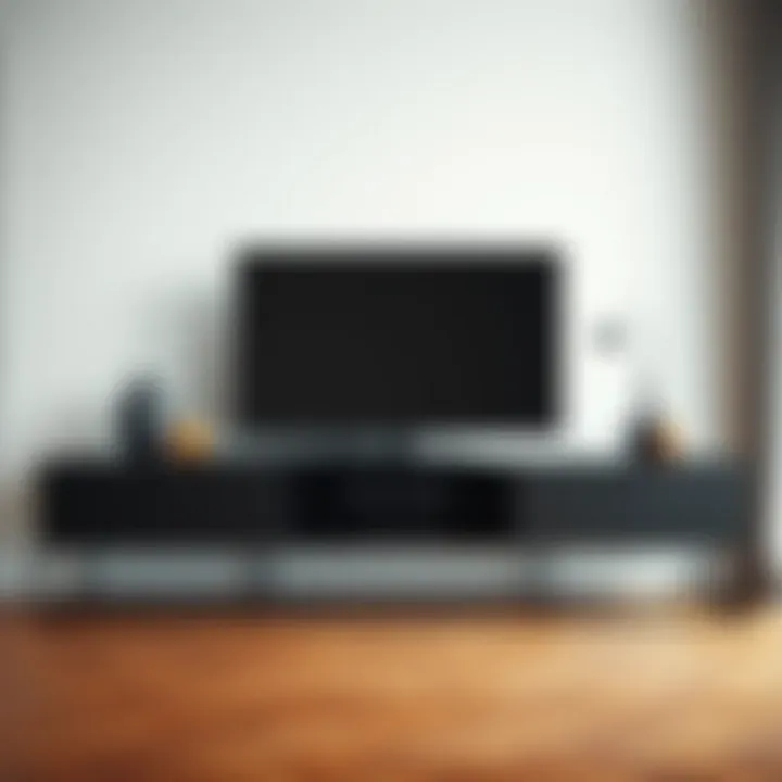 Stylish black metal legged TV unit against a minimalist backdrop