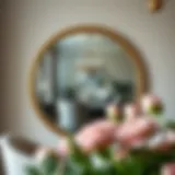 Elegant round mirror reflecting a dining area